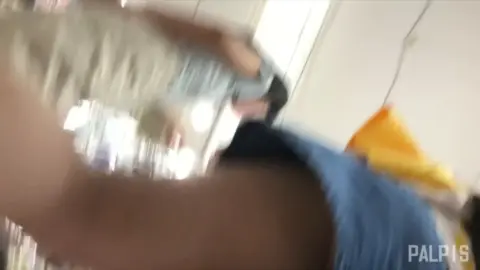 Asian Couple Kissing in Store