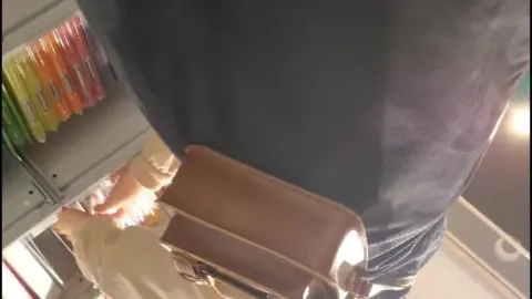 Blonde Masturbating in Store