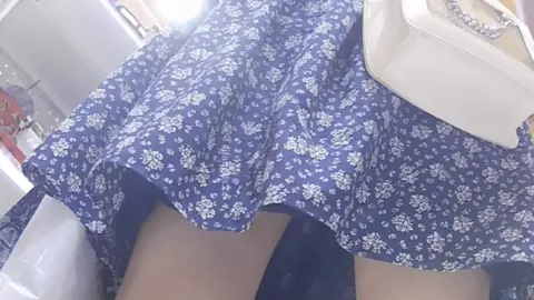 Blonde Asian in Blue Dress Shopping