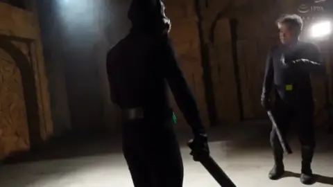 Asian Cosplay Duo Encounter in Dungeon Setting