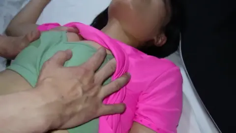 Asian Couple Intimate Moments on Bed