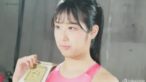 Asian Women Wrestling in Ring