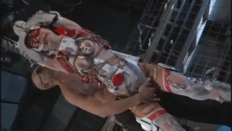 Asian Couple in Bondage Costume