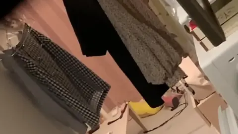 Asian Teen Sitting in Bedroom