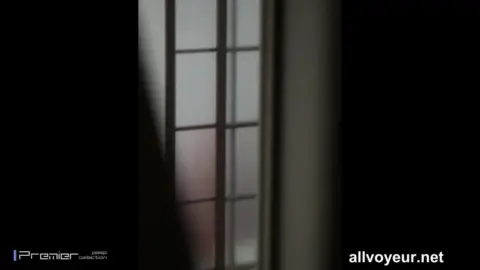 Blonde Bombshell Sitting on Bed