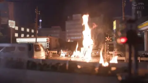 Asian Girl with Large Buttocks in Cityscape
