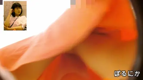 Asian Girls Try On Clothes in Store