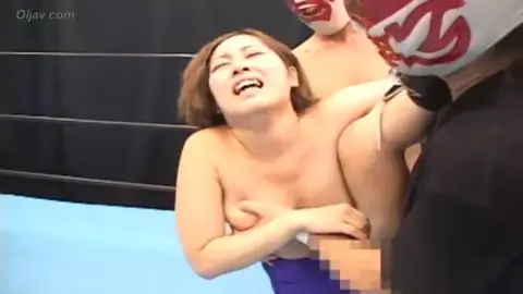 Asian Wrestlers Engage in Intense Grappling Match