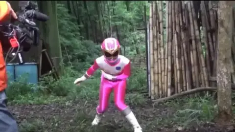 Asian Women in Costume Fighting in Forest