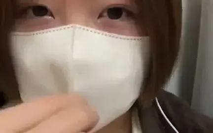 Asian Girl with Face Mask Plays with Vibrator