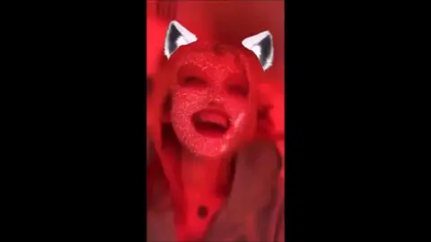 Blonde in Cat Ears Sings in Red Room