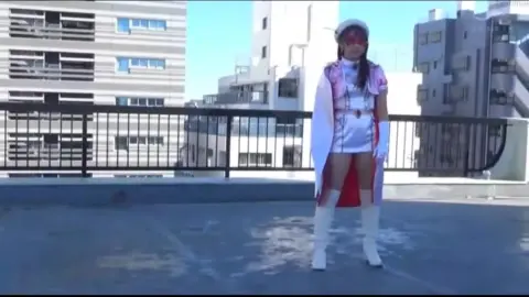 Asian Cosplay Duo Interact on Rooftop