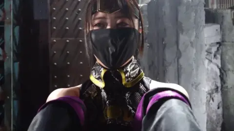 Asian Girls in Masks and Costumes