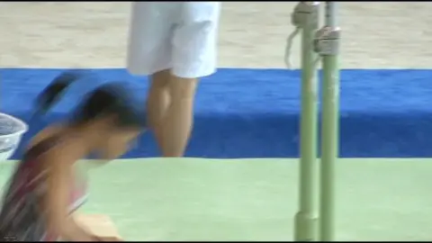 Asian Gymnast Performs Solo
