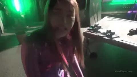 Asian Woman in Leather Outfit Tortures Man