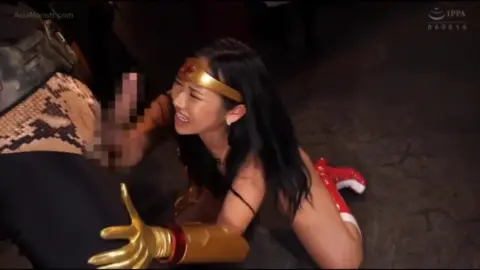 Asian Couple Engaging in Explicit Acts with Costumes and Restraint