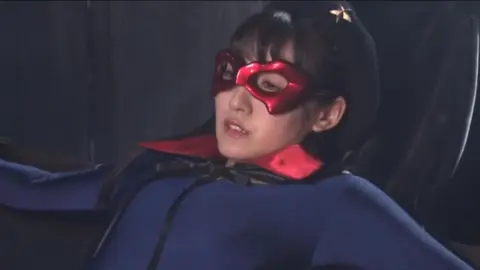 Asian Girl in Mask and Cape