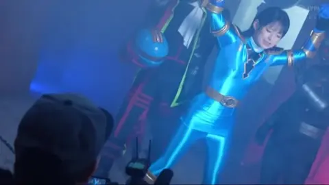 Dynamic Fight Scene with Helmeted Performer