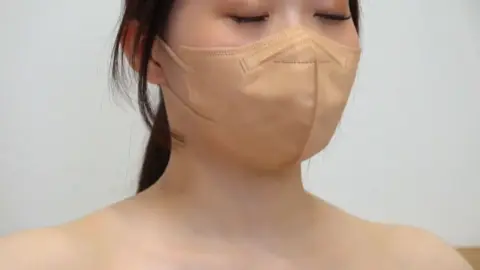 Asian Girl with Ponytail and Face Mask