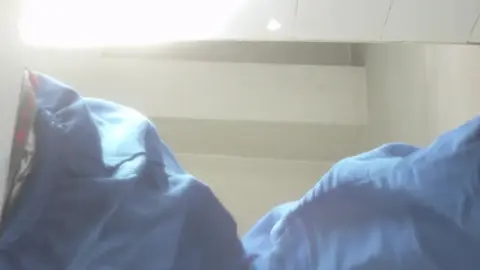 Slim Caucasian Girl Exposes Buttocks in Bathroom