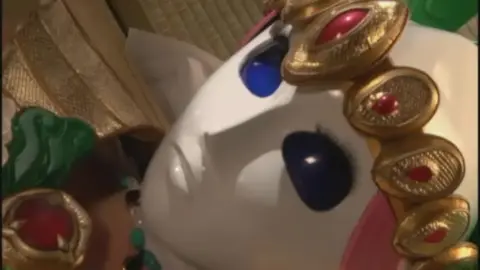 Asian Women in Costumes Engage in Intimate Group Scene