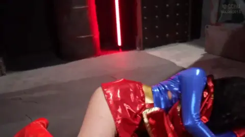 Asian Woman in Red Lipstick with Man in Dark Studio