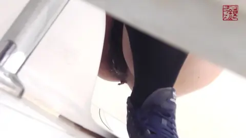 Asian Girl Urinating in Bathroom