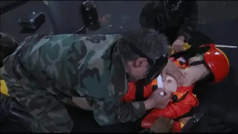 Asian Performers in Camouflage and Red Costume Scene