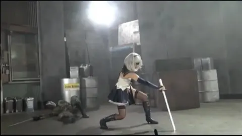 Asian Woman in Industrial Setting