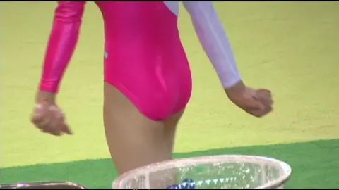 Legs Apart and Bending Over