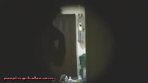 Dark-Haired Beauty Masturbates in Dimly Lit Bedroom