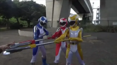 Asian Women in Cosplay Engage in Fantasy Fight Scenes