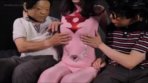 Asian Women in Pink Bodysuits Engaged in Explicit Acts