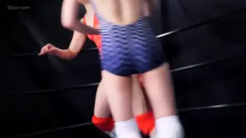 Asian Women Wrestling in Ring