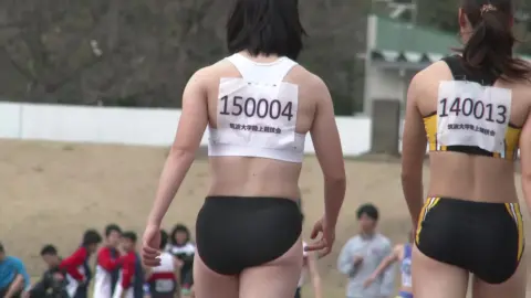 Asian Athletes at Track and Field Event