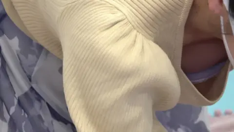 Slim Caucasian Woman Exposing Bra and Cleavage