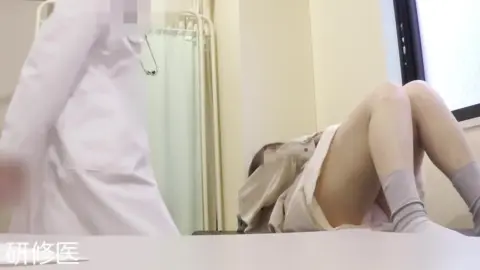 Asian Couple in Medical Room Examination