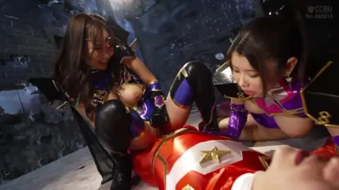 Asian Lesbians in Dimly Lit Room