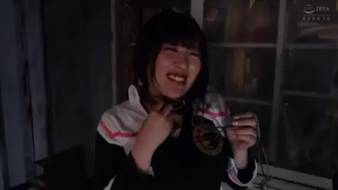 Asian Women in Costumes Posing in Control Room