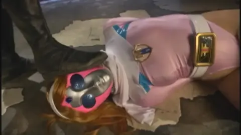 Silver Armored Figure Dominates Orange-Haired Woman