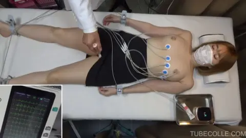 Redheaded Woman in Medical Exam Room