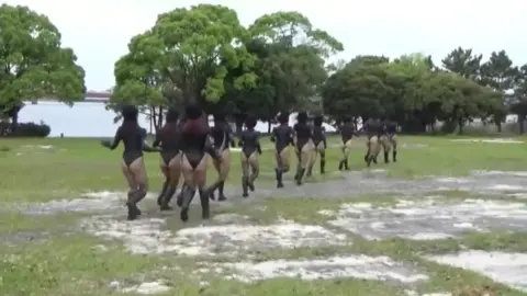 Asian Girls in Black Bodysuits Outdoor Escapade