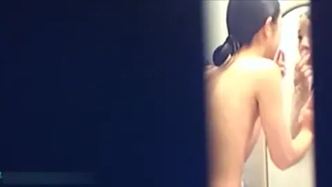 Asian Beauty in Bathroom Routine