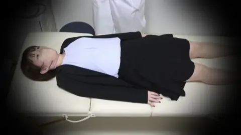 Asian teens examined by doctor in medical room