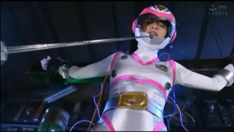 Asian Women in Futuristic Costumes Being Restrained
