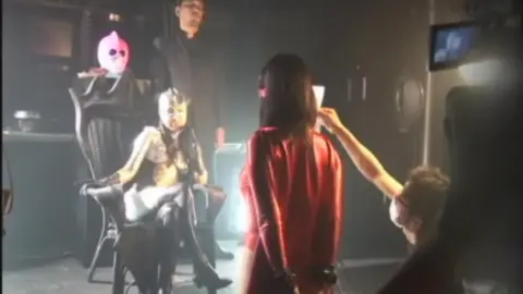 Asian Models in Costumes and Masks