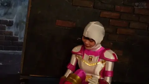 Asian Performers in Costume Wrestling Match