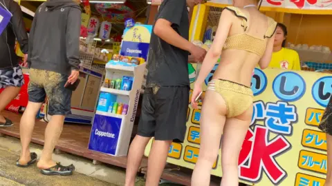 Asian Beachgoers in Swimsuits