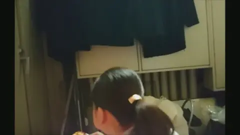 Asian Teen Plays Alone in Bedroom