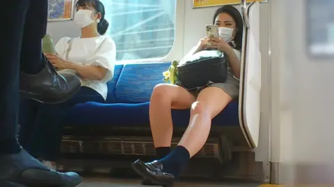 Asian Teen Girls in Skirts on Train